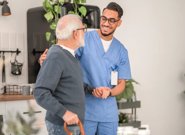 Nurse assisting a patient to walk